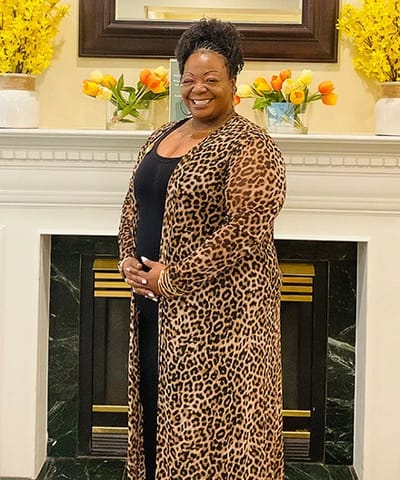 Resident smiling in a welcoming common area
