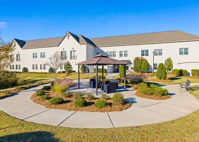 Beautiful outdoor seating area with gazebo and landscaped grounds