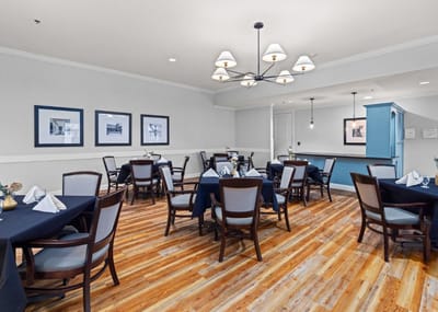 Bright dining room with tables set for a meal
