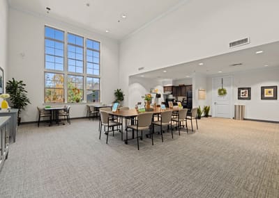 Bright common area with tables and chairs
