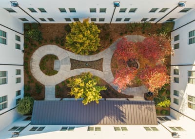 Aerial view of a courtyard with trees and pathways