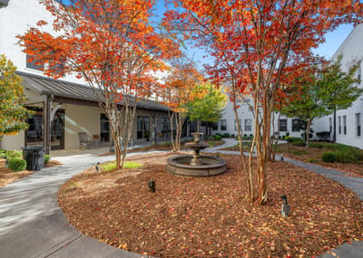 Beautiful courtyard with colorful autumn trees and fountain