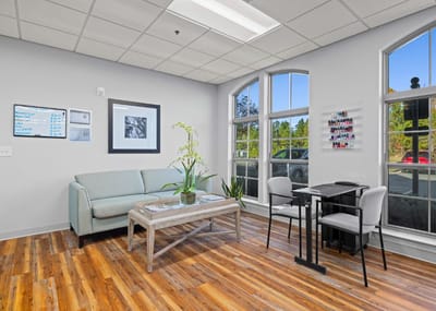 Bright common area with seating and natural light