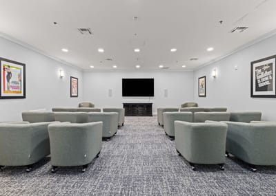 Interior view of a cozy movie room with chairs