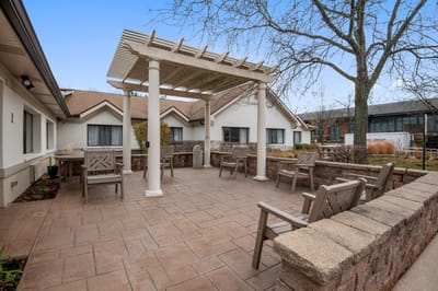 Outdoor seating area with pergola and benches