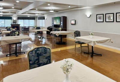 Interior dining area with tables set for meals