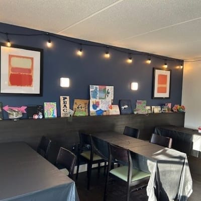 Dining area with artwork on the walls
