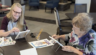 Residents engaged in a painting activity