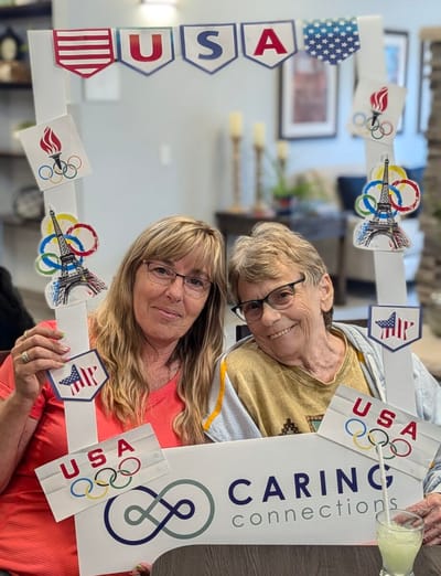 Residents celebrating with an Olympic-themed frame