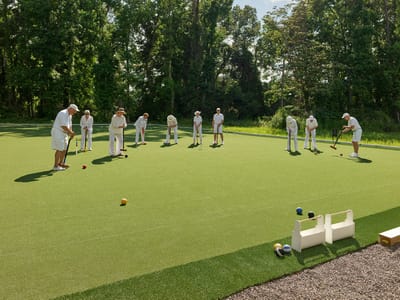 Residents enjoying a game of lawn bowling outdoors