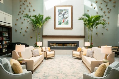 Bright common area with comfortable seating and plants