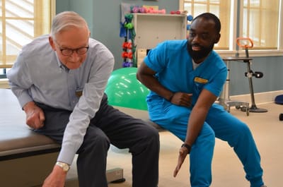 Resident and staff member engaging in a therapy session