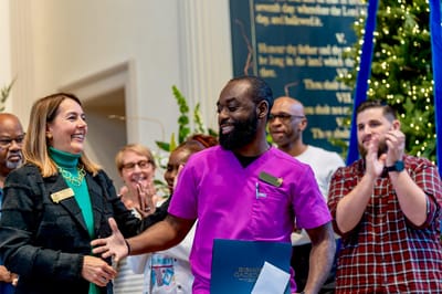 Staff celebrating an event inside the facility