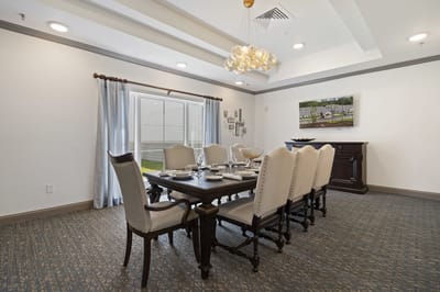 Elegant dining room setup with a large table and chairs