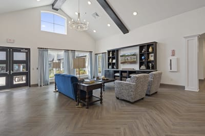 Brightly lit common area with seating and decor