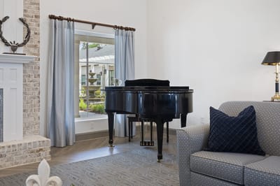 Interior view of a lounge area with a piano