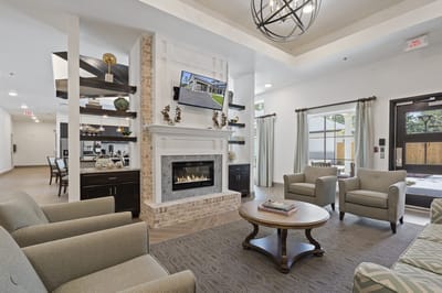 Cozy common area with seating and a fireplace