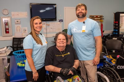 Staff member with resident in rehabilitation facility