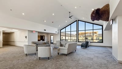 Interior common area with seating and large windows