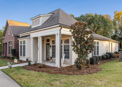 Exterior view of a senior living facility with landscaping