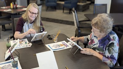Residents engaging in a painting activity