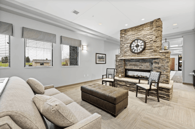 Comfortable lounge area with stone fireplace and seating