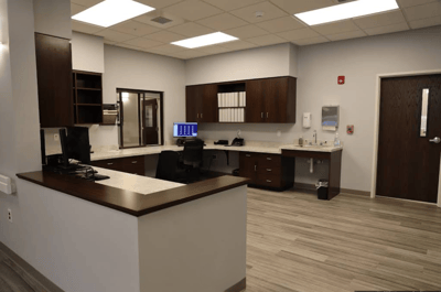 Modern interior office space with desk and computer