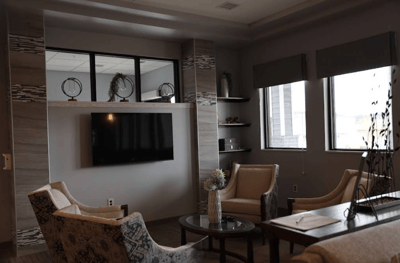 Bright common area with comfortable seating and TV