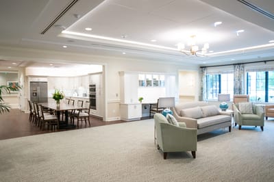 Bright common area with seating and dining space