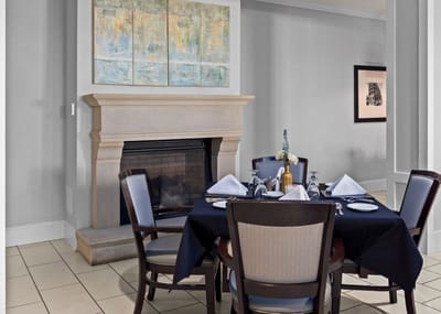 Elegant dining room with a fireplace and table set