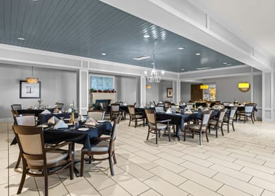 Elegant dining room with tables set for a meal
