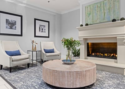 Cozy lounge area with chairs and fireplace