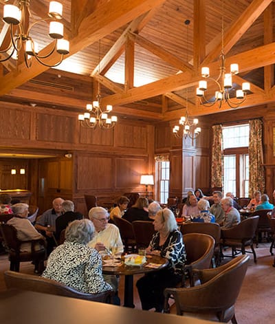Residents enjoying a group activity in a cozy common area