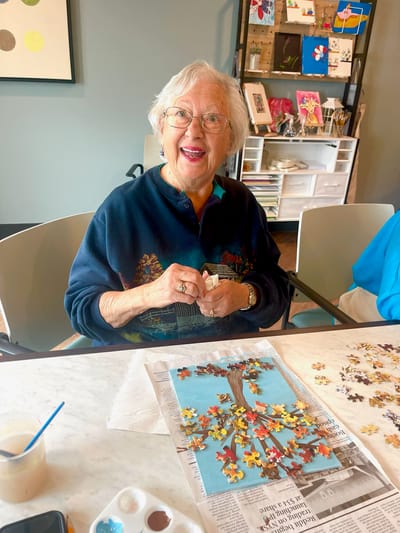 Senior resident engaged in a puzzle activity
