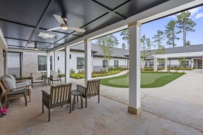 Outdoor seating area with putting green at a facility