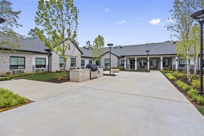 Exterior view of the assisted living facility with landscaping