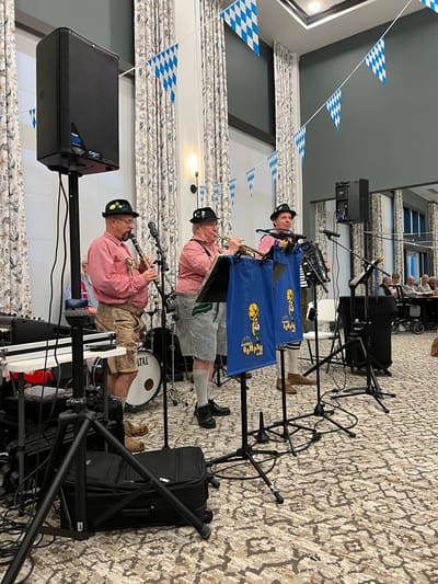 Musicians performing in a festive common area