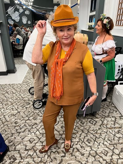 Resident celebrating in a festive outfit at a community event
