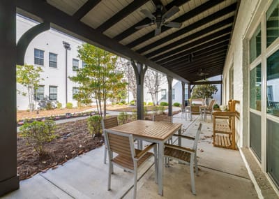 Patio area with seating and greenery