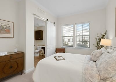 Cozy furnished bedroom with natural light
