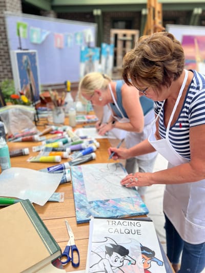 Residents engaged in an outdoor art activity