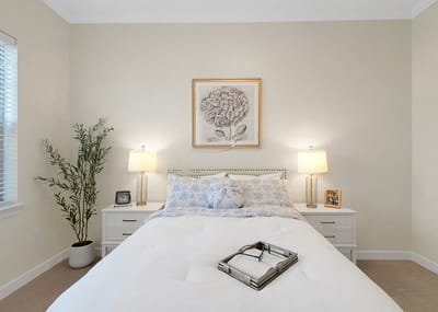 Cozy bedroom with decorative artwork and lamps