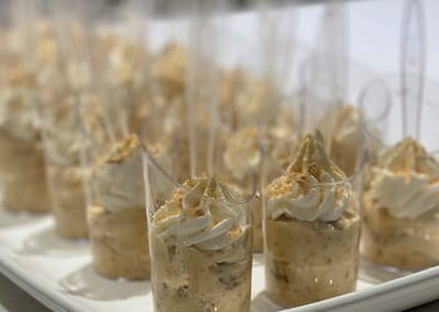 Close-up of dessert cups arranged on a tray