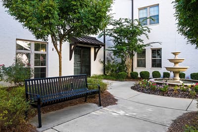 Quiet outdoor courtyard with seating and fountain