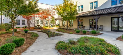 Beautifully landscaped outdoor pathway with seating