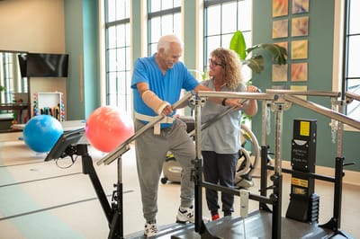 A resident receiving rehabilitation therapy with a staff member