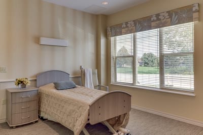 Cozy private resident room with a bed and window