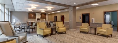 Bright common area with seating and kitchenette