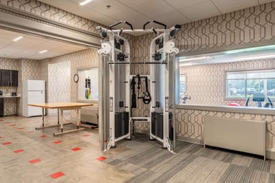 Fitness equipment in a well-lit exercise room