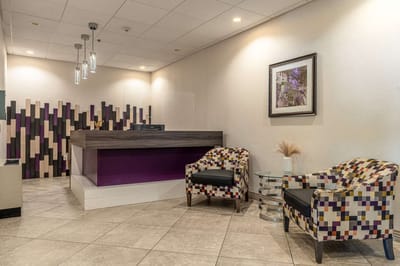 Interior view of a lobby with seating area and reception desk